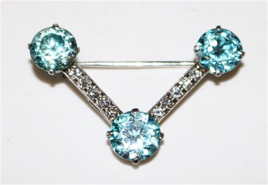 Blue zircon and diamond brooch